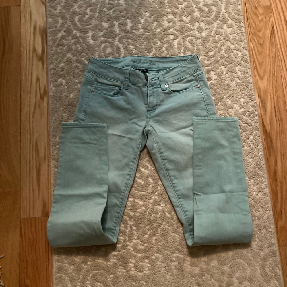 Greenish blue stretch skinny jeans